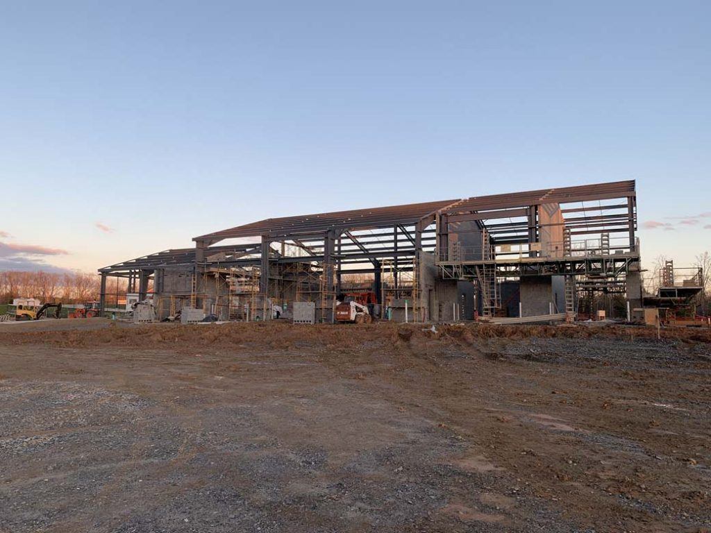 metal frame system on a construction site prior to structural insulate panels installed