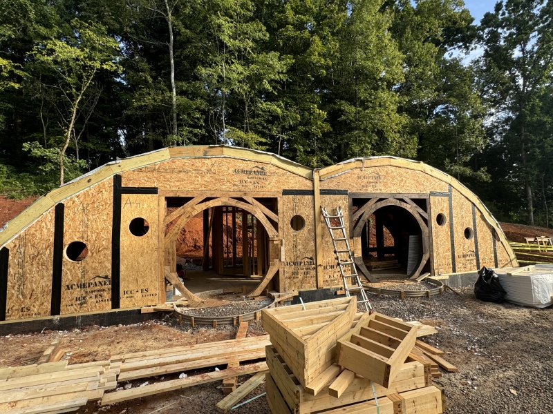 exterior construction of a tiny home with curved SIP roof