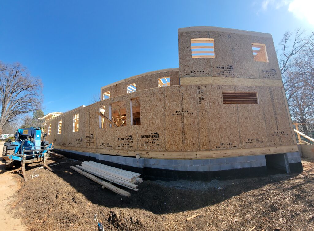 SIP wall panels with ACME Panel branding forming the second story of a Charlotte, NC home during construction