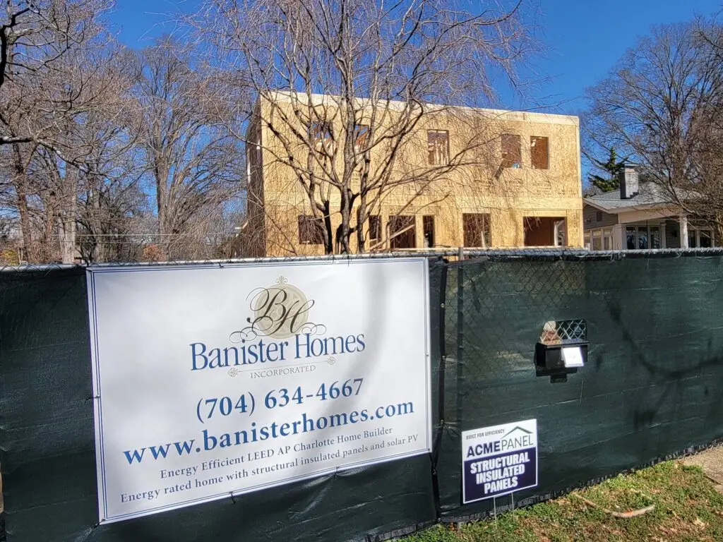 Banister Homes and ACME Panel job site signs posted outside a SIP home under construction in Charlotte, NC
