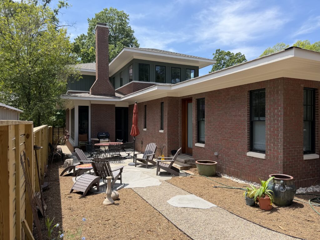 Private patio with outdoor seating behind the completed SIP home in Charlotte's Elizabeth neighborhood